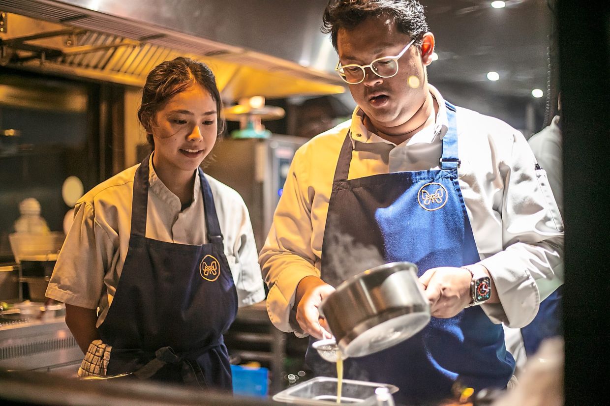 At Mia, Goh says 85% of the kitchen and service team is female and part of the reason is because she and Top (pictured here) actively try and cultivate a harmonious work environment where staff constantly learn new skills. — MIA RESTAURANT