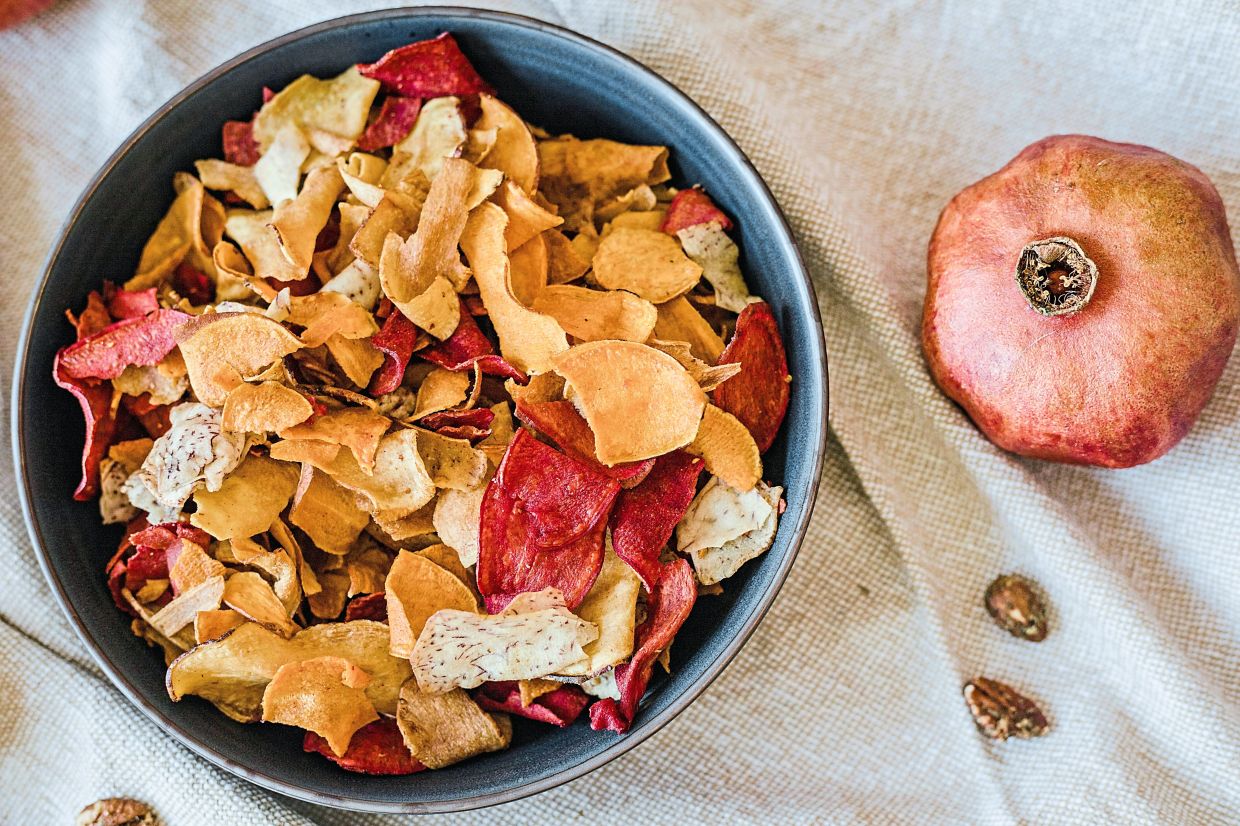 The columnist recommends that people make their own fruit or vegetable chips at home instead of indulging in ultra-processed foods. — RDNE STOCK PROJECT/Pexels