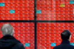 Asian trade cautious ahead of key rate decisions