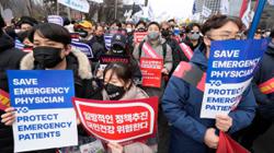 South Korea suspends the licenses of two senior doctors in first punitive steps over doctors' walkouts