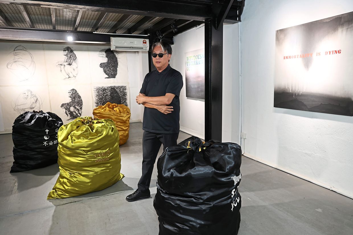 A recurring motif, a money sack, is Lim's commentary on societal values. Their understated presence prompts visitors to ponder the incessant demand for resources in a world increasingly divided by disparities. Photo: The Star/Glenn Guan 